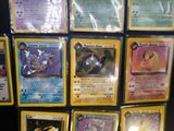 a lot of pokemon cards that are on the table