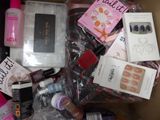 a box full of nail polishes and other beauty products