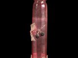 a pink glass vase with a bird on it ' s neck