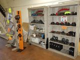 a room filled with lots of different types of helmets