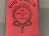 the book is red with black lettering and a picture of a snake on it