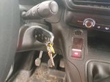 a car dashboard with a key in the center of it