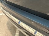a close up of a car ' s bumper with a sticker on it