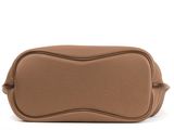 a brown leather bag with a metal handle on a white background