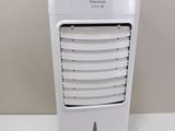a small white air conditioner sitting on a table