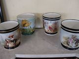 four cups that are sitting on a table
