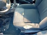 a picture of a car with a broken seat and a broken steering wheel