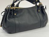 a black leather handbag on a white background