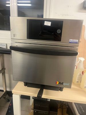 a microwave and a microwave oven sitting on a shelf