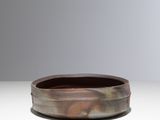 a close up of a small bowl on a table