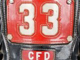 a close up of a fireman ' s helmet with the number 33 on it
