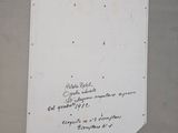 a white easel with a piece of paper on top of it