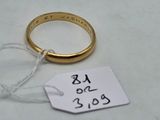 a gold ring with a price tag on it