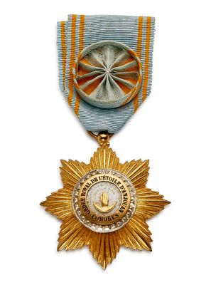 l'image d'une médaille surmontée d'une étoile