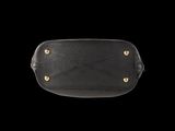a black leather belt bag with gold studding on the front
