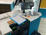 a desk with a laptop and a backpack on it