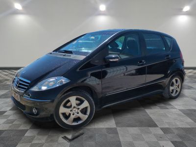 a picture of a black car parked in a garage