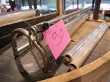a pink sticker on the handle of a metal barrel