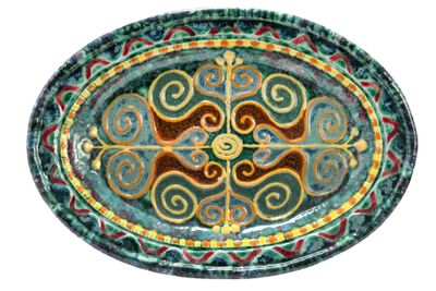 a picture of a green and red plate with a design on it