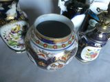 three vases sitting next to each other on a table