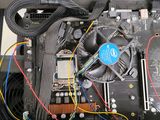 a close up of a computer motherboard with wires attached