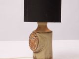 a small table lamp with a black shade on it