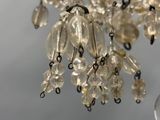 a chandelier with a bunch of glass beads hanging from it