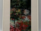 tableau représentant un jardin avec des fleurs et des arbres, dans un cadre blanc