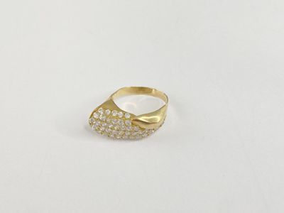 a close up of a gold ring with diamonds on a white surface