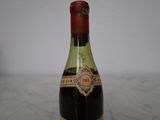 a bottle of wine that is sitting on a table