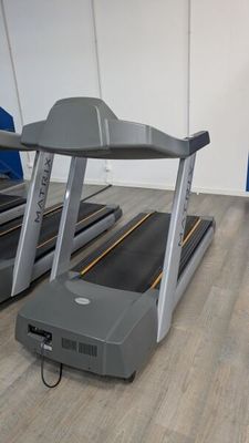 two tread machines that are on the floor in the room