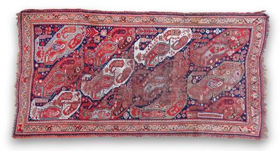 an antique persian rug with a red and blue design