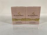 two boxes of burberry perfume on a white surface
