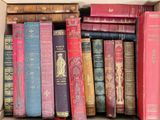 a box full of old books sitting on a table