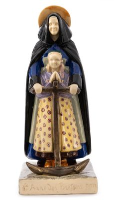 a figurine of a woman holding a child in her arms