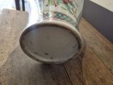 a vase that is sitting on a wooden table
