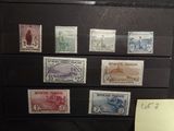 a lot of stamps that are on display in a case