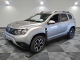 a picture of a silver dacia parked on a checkered floor