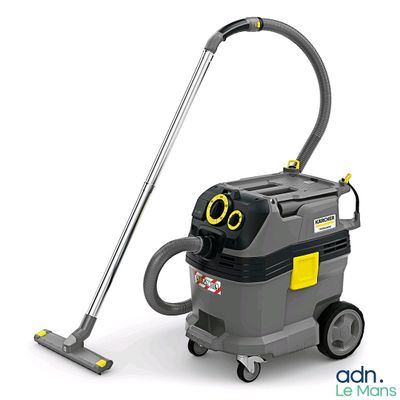 a grey and yellow vacuum cleanerer sitting on top of a white surface