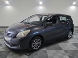 a picture of a grey car in a showroom