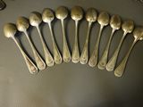 a lot of spoons that are sitting on a table