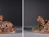 deux photos d'une statue représentant un ours sur un rocher