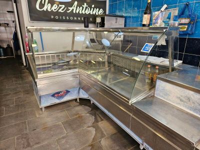 a counter with a variety of food items inside of it
