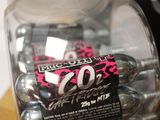 a jar of candy sitting on a table next to a remote control
