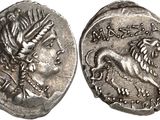 a silver coin with a dragon on the front and a lion on the back