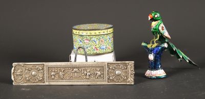two figurines of birds and a box on a table