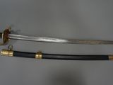 an image of a pair of swords sitting on top of a table