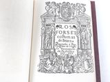an old book with a drawing of a building on it