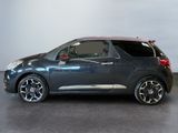 the small car is parked on the concrete floor in the room