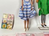 two dolls that are next to each other on a table